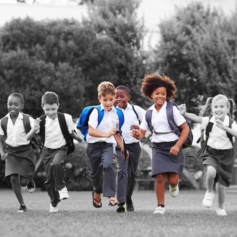 group of school children running